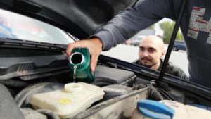 replacing dirty car engine oil